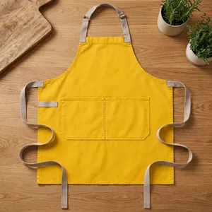 Delantal Amarillo Resistente y Reutilizable con Bolsillos Dobles, Tejido de Lona, Lavable a Máquina, para Limpieza y Uso Diario - Product Image 1