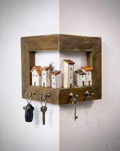 Charming corner-mount wooden key holder with miniature village art. Available at wholesale prices - Product Image 1