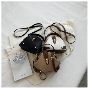 Elegantes bolsos de mano en forma de cúpula de cuero PU con asa superior y correa para el hombro con detalles dorados para mujeres, ideales para uso diario y de viaje. - Product Image 3