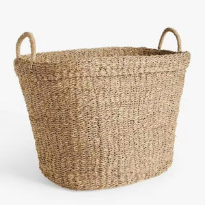 Esta gran cesta de algas marinas ovalada está hecha de algas marinas naturales. Es ideal para almacenar mantas, cojines, juguetes o zapatos. - Product Image 1