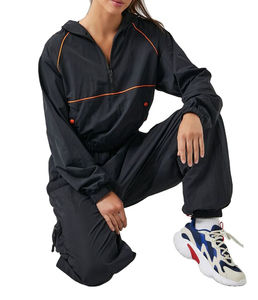 Conjuntos cortavientos de ropa deportiva para mujer con logotipo personalizado de alta calidad, chándal holgado de talla grande transpirable a prueba de viento - Product Image 1