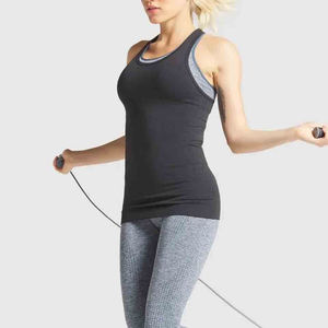 Camisetas sin mangas de entrenamiento para mujer OEM transpirables de punto Spandex secado rápido de algodón sin mangas sólido informal ecológico - Product Image 2