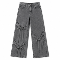 Jean ample taille haute pour femme style Y2K avec détail noué, coupe décontractée, denim délavé clair, écologique et respirant, idéal pour l'été