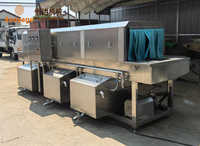 Machine de lavage industrielle continue de type tunnel pour paniers, boîtes, palettes, plateaux et caisses en plastique, utilisable par une seule personne