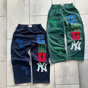 กางเกงวอร์มขาบานสำหรับผู้ชายกางเกงวิ่งขาใหญ่ผ้าฝ้ายขนแกะพิมพ์โลโก้ - Product Image 6