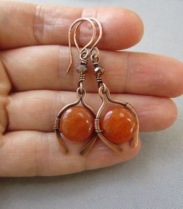 Boucle d'oreille en cuivre fini antique au look ethnique intemporel créé pour les amateurs de bijoux de style traditionnel - Product Image 6