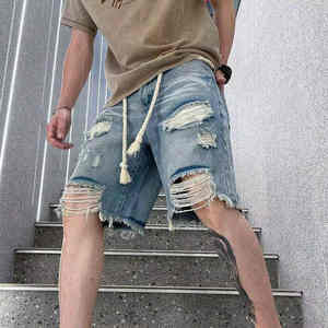 กางเกงยีนส์ขาสั้นทรงหลวมสำหรับผู้ชายขาสั้นผ้ายีนส์เอวยางยืดล้างว่างเปล่า - Product Image 1