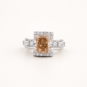 IGI Certified Radiant Cut Orange Lab Grown Diamond Halo <b>Ring</b> With Baguette Side Stones in 9K White / Rose & Yellow Gold - Product Image 1