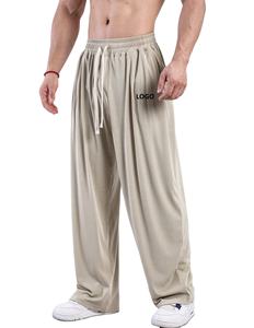 Ropa deportiva informal con logotipo personalizado para hombre, ropa de calle ligera de poliéster, pantalones para correr, pantalones de chándal holgados para entrenamiento en el gimnasio - Product Image 1