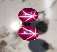 Rubis étoile lumineux créé en laboratoire, 6 rayons, pierre rare, affiche un asterisme radiant, symbole de force, de passion, d'élégance royale intemporelle
