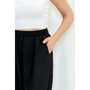 Tessuto crêpe nero, il modello estivo non ti fa sudare, pantaloni larghi da donna