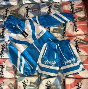 ชุดเซ็ตสองชิ้นแบบใหม่ ดีไซน์ใหม่ ยูนิเซ็กซ์ ผ้าไนลอน 100% คุณภาพสูง ชุดวอร์มมีฮู้ด ซิป ระบายอากาศได้ดี - Product Image 1