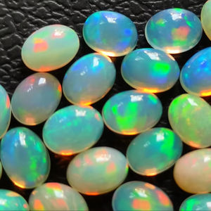 Piedra preciosa de ópalo etíope en forma ovalada 3x5mm ópalos pequeños naturales blancos para joyería parte posterior plana ópalo cabinas sueltas precio al por mayor - Product Image 1