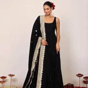 The rich black hue sets the stage for a celebration of timeless elegance while the ankle-length Anarkali kurta at lowest price