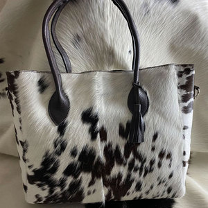 Bolsos de mano de piel de vaca a precio barato hechos en fábrica a la venta Material duradero gran oferta bolsos de mano de piel de vaca a la moda - Product Image 1