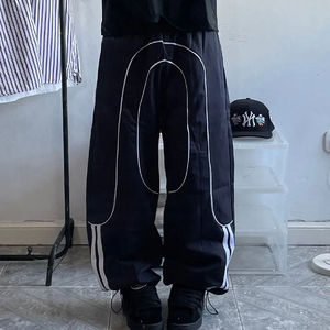 Nouveau pantalon en nylon unisexe coupe ample avec ourlet coupe-vent, coupe régulière, jambe large, nylon - Product Image 3