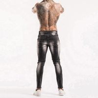Jean en denim délavé coupe slim pour homme, taille mi-haute, jambe droite, en coton, style décontracté automne