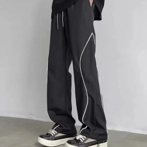 Pantalones de chándal acampanados sueltos informales de alta calidad personalizados para hombre, pantalones de chándal con botones laterales de poliéster para correr de nailon para hombre - Product Image 1