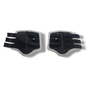 Bottes de protection pour chevaux équestres durables avec doublure en fourrure douce de nouvelle conception croisée et cuir artificiel pour le brossage à cheval - Product Image 1