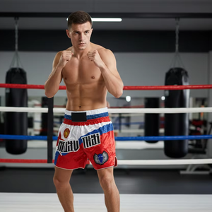 Short de Muay Thai personnalisé avec panneau latéral en maille respirante, flux d'air, patchwork satiné, logo frontal, 100% polyester - Product Image 1