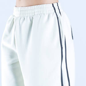 Pantalons de survêtement pour femmes de haute qualité, sur mesure, en coton blanc, à jambes larges et surdimensionnées, avec des bandes latérales - Product Image 6