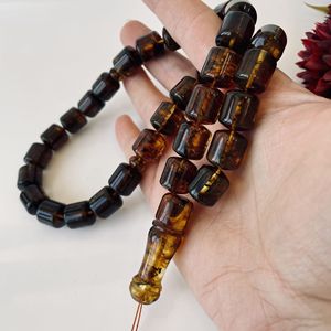 Misbaha en ambre vert de la Baltique, perles naturelles en forme de baril avec des inclusions végétales - Product Image 1