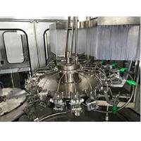 Machine de remplissage de sodas gazeux électrique automatique haute précision 3-en-1 (rinçage, remplissage, bouchage) monobloc avec emballage en carton