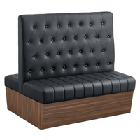 Canapé de banquette double face en cuir noir capitonné pour café