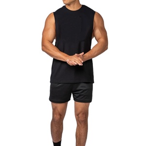 Camiseta sin mangas con corte lateral, diseño liso, personalizable con logo serigrafiado, estilo deportivo holgado y moderno para gimnasio, en blanco. - Product Image 5