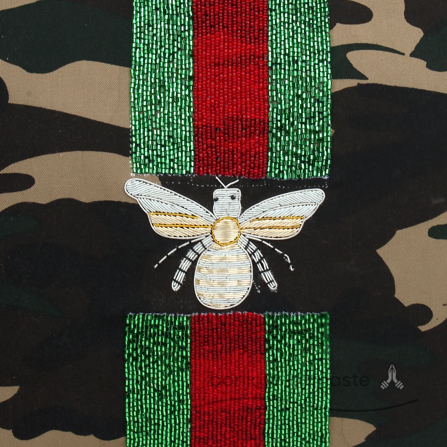 Camouflage print with black, brown & orange motifs