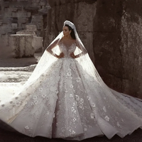 Robe de mariée de luxe en dentelle sirène transparente, ornée d'appliques, de sequins, de perles, de broderies et de fleurs, à manches longues et traîne balayante