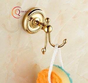 Catégorie de produit Cintre plaqué brillant Crochet mural couleur or en métal solide Cintre décoratif en tissu pour manteaux et chapeaux Crochets et rails - Product Image 1