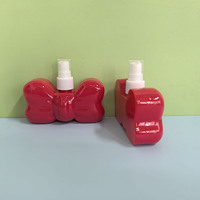 Bouteille de pulvérisation de brouillard d'alcool en plastique en forme d'arc créatif rouge personnalisé 100ml bouteilles de pulvérisation de soins de la peau de corps de visage bouteille de parfum à la maison de voiture