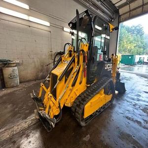 Mini-chargeuse sur chenilles JCB 1CXLT jaune avec godet frontal pour la construction - Product Image 3