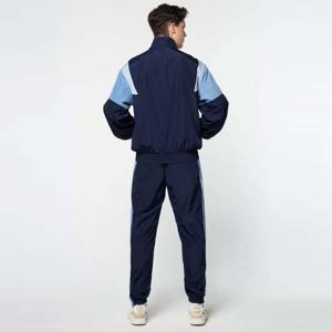 Chaqueta de chándal unisex con bloques de color Chaqueta atlética moderna y cómoda para trotar, trajes casuales y actividades al aire libre - Product Image 3