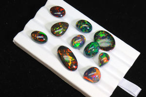 โอปอลดำเอธิโอเปียแท้ ทรงหลังเบี้ย 68 กะรัต ล็อต - โอปอลดำรมควัน 10 ชิ้น รูปทรงคละแบบ ราคาขายส่ง - Product Image 4