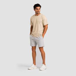 เสื้อยืดคอตตอน 100% รุ่น Essential Flow สีเบจ ทรงปกติ ออกแบบหลวมๆ สำหรับออกกำลังกาย พิมพ์ลาย หมายเลขรุ่น - Product Image 4