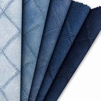 Tissu PU imperméable résistant à l'abrasion et aux taches de 0,6 mm avec motif grain de jean imprimé pour la décoration de canapé