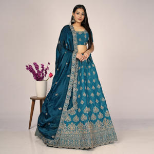 Lehenga Choli brodé de luxe avec des détails de motifs élégants sur toute la surface, un travail de bordure riche et un dupatta doux et fluide - Product Image 1
