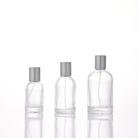 Flacon de parfum cylindrique en verre à épaule inclinée avec pompe pulvérisatrice, capuchon en plastique mat, boîte en papier personnalisée disponible en gros