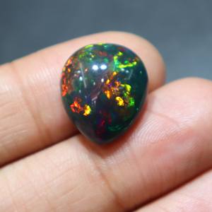 โอปอลดำเอธิโอเปียธรรมชาติทรงหลังเบี้ยเรียบ สำหรับทำเครื่องประดับ - Product Image 1