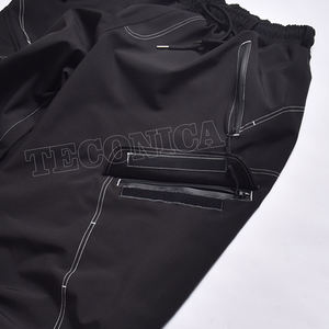 Pantalons de snowboard noirs 100 % polyester disponibles en OEM, avec surpiqûres contrastées, grandes poches et doublure intérieure chaude - Product Image 5