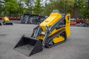 Minicargadora Wacker Neuson SM100 con orugas amarillas, minicargadora compacta para manejo de materiales - Product Image 1