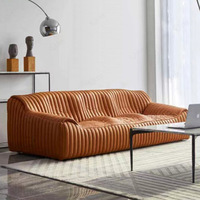Canapé trois places en cuir véritable style moderne, design vague caramel, pour appartement, chambre, hall d'hôtel, salon