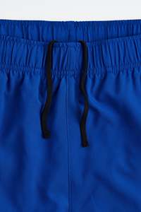 กางเกงขาสั้นสำหรับวิ่งออกกำลังกายกีฬาฤดูร้อนแบบลำลองของผู้ชายป้องกันรอยยับสบายโลโก้สีทึบยืดหยุ่นได้ - Product Image 6