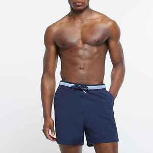 Pantalones cortos de baño de playa de color sólido para hombre con logotipo personalizado con cierre de cordón de tela de lona de secado rápido - Product Image 1
