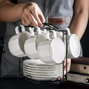 Support de tasse en métal magnifiquement conçu pour les amateurs de café avec un design de défilement artistique et une finition enduite de poudre durable - Product Image 2