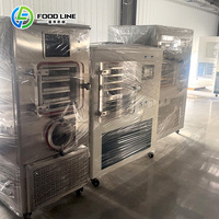 Compacte vriesdroogmachine voor fruit, groenten en voedsel, geschikt voor huishoudelijk gebruik.