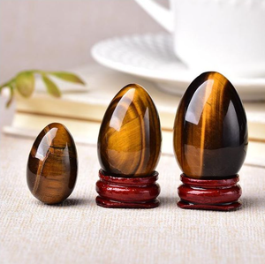 Venta al por mayor de alta calidad Ojo de tigre Yoni huevos cristal Natural Ojo de Tigre huevo piedra Reiki curación meditación y decoración del hogar - Product Image 1