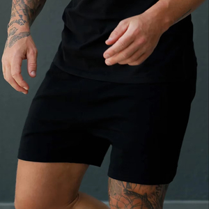 Vente en gros de shorts de gym de couleur noire en jersey pour hommes OEM avec logo personnalisé shorts d'entraînement en coton respirant et extensible fournisseur de vêtements de sport - Product Image 1